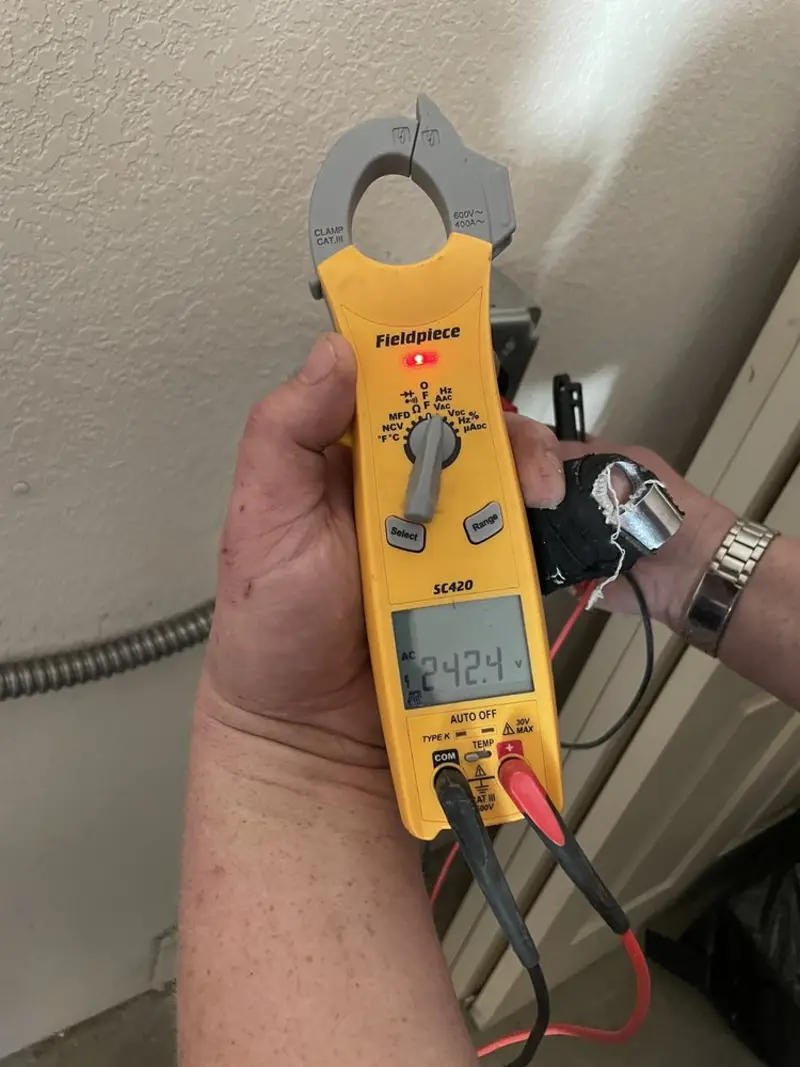 Voltage testing with clamp meter during Outlet Installation in Ranchettes